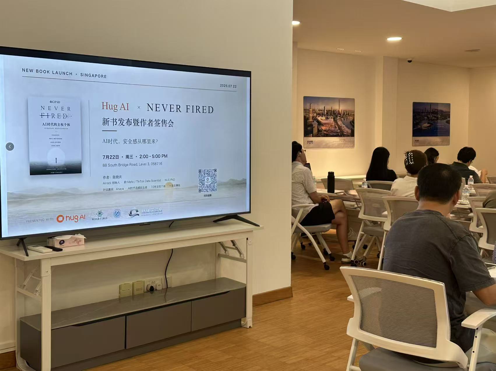 The Hug AI × NEVER FIRED event setting and presentation in Singapore